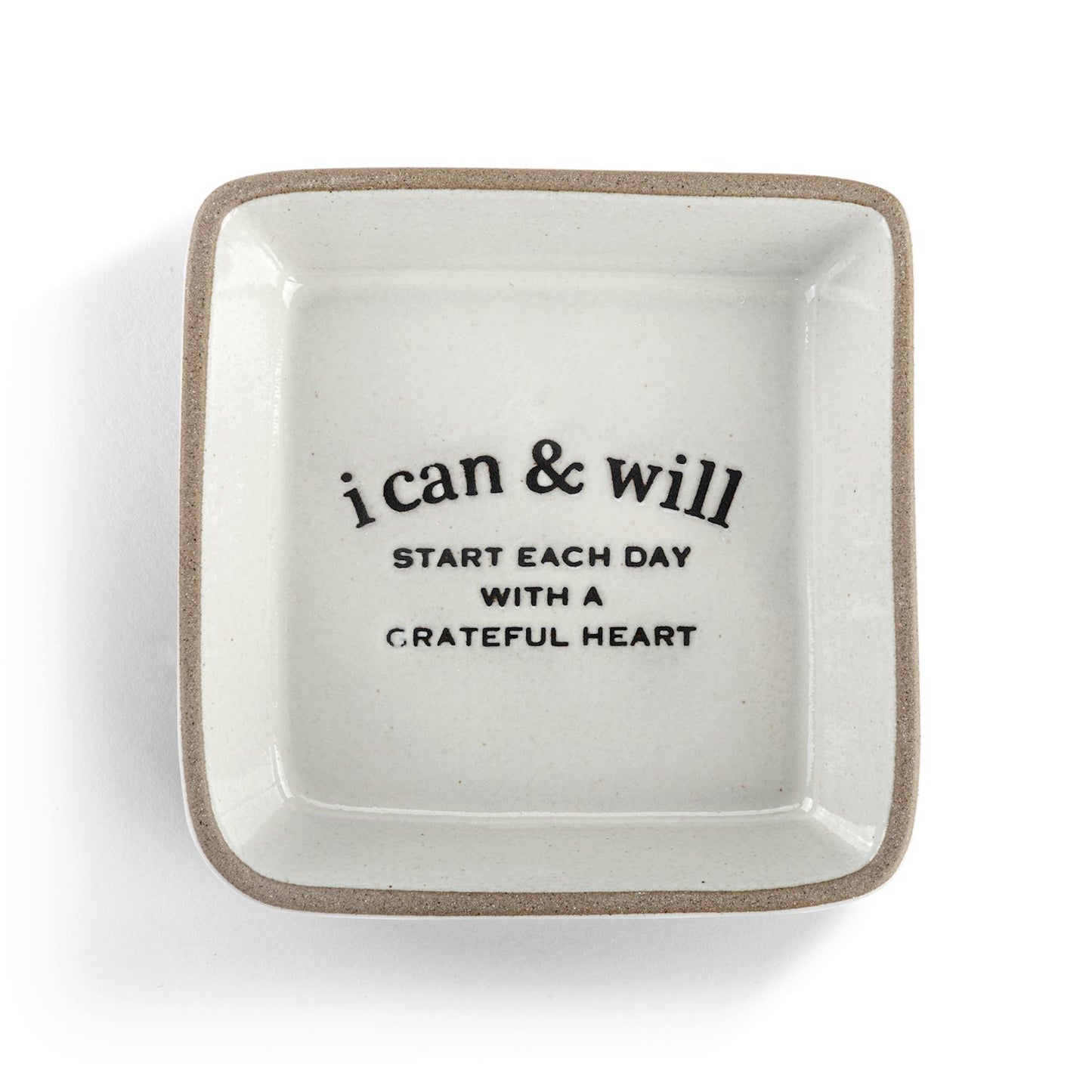White ceramic trinket dish with motivational quote on a white background