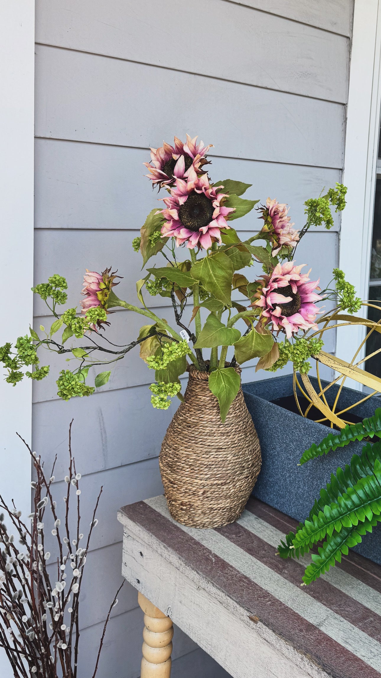 Sunflowers and Green Blossom branch Arrangement in Seagrass Vase