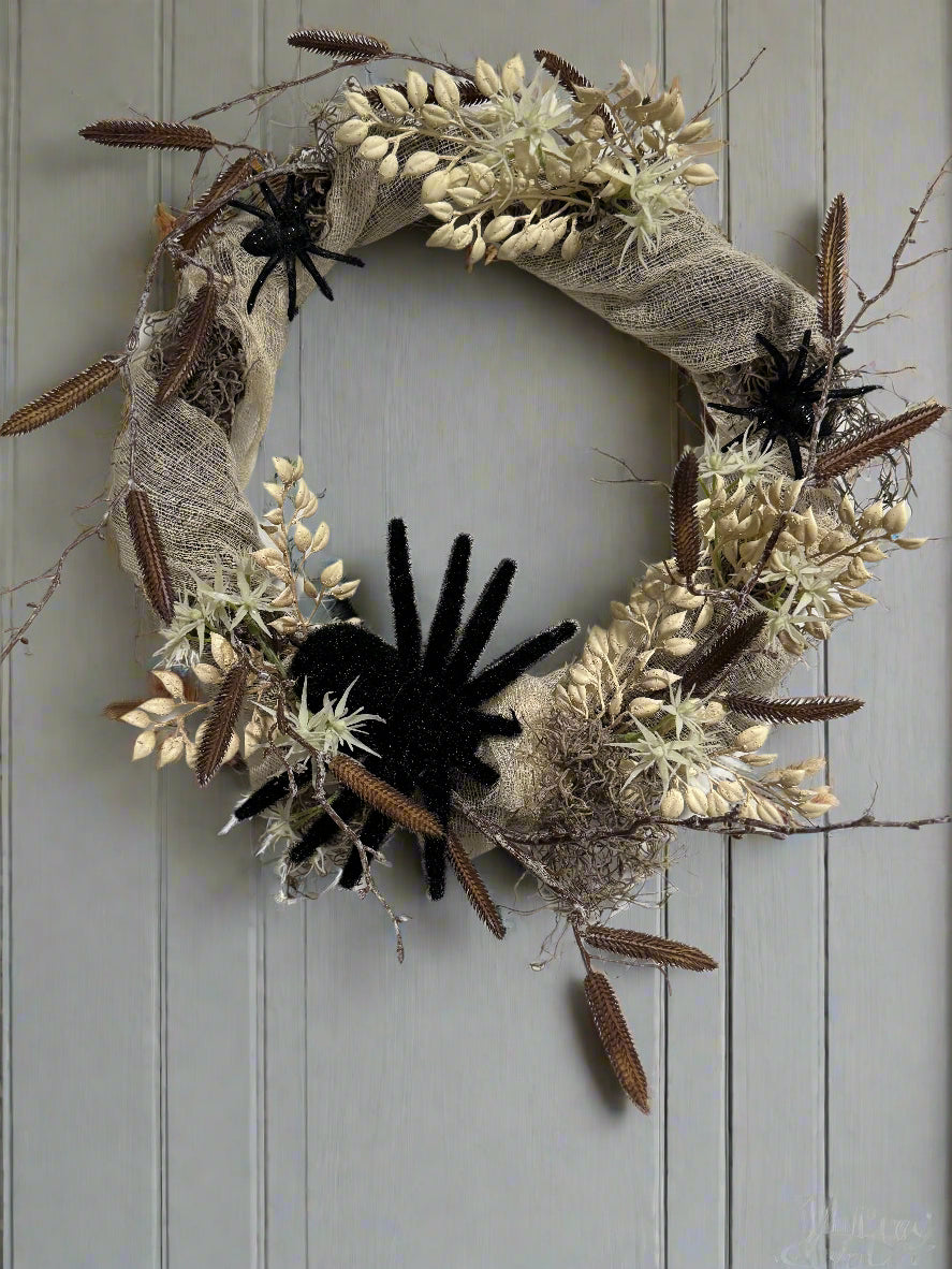 Halloween wreath with spiders, mummy gauze and florals