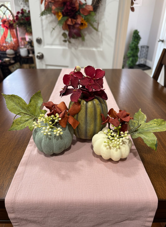 Decorative arrangement of flowers and pumpkins 
