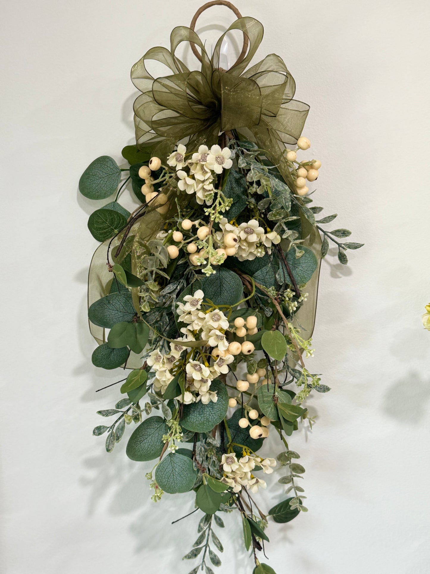 Decorated eucalyptus and wax flower swag