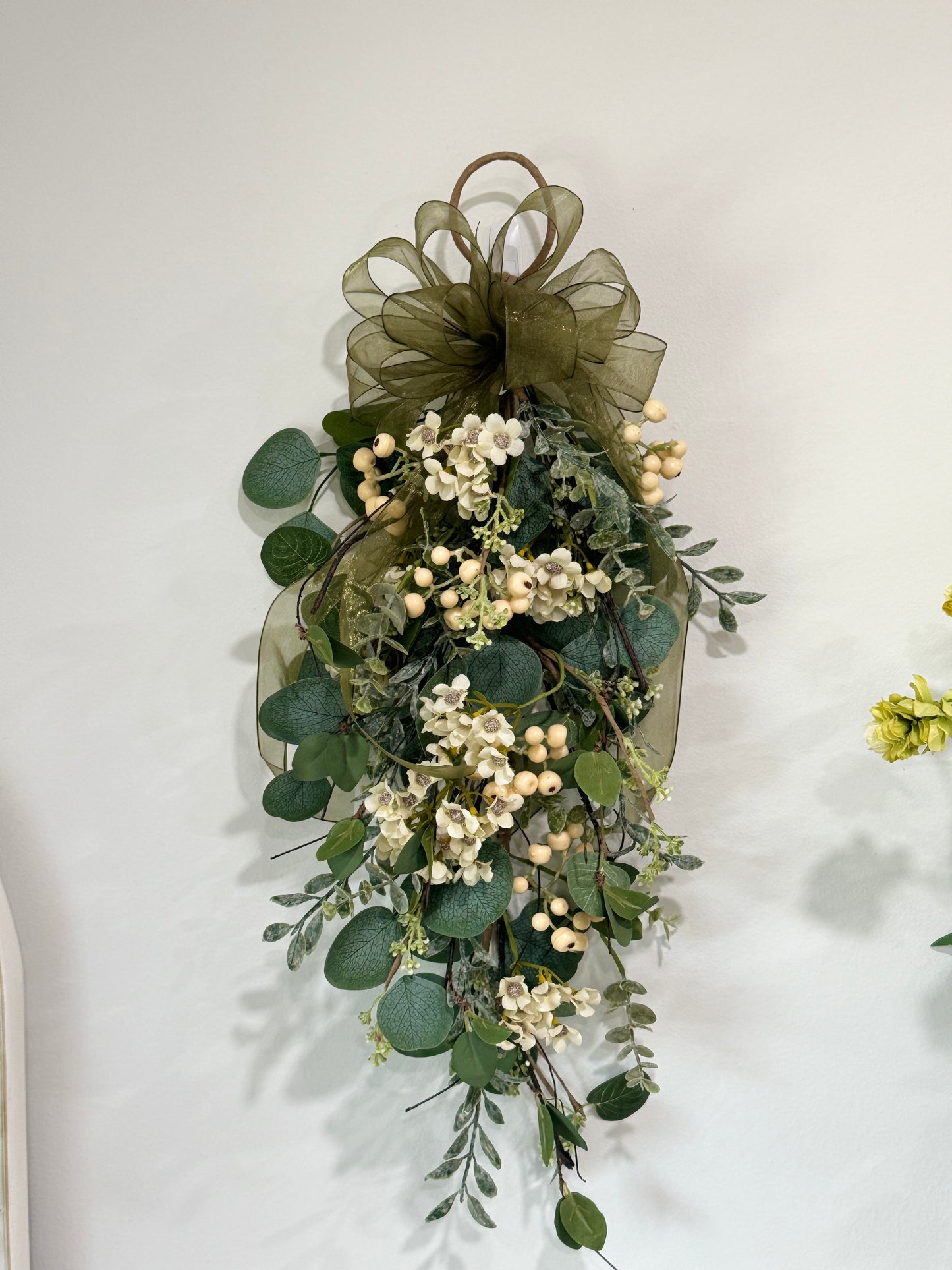 Decorated eucalyptus and wax flower swag