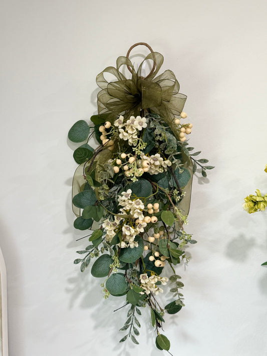 Decorated eucalyptus and wax flower swag